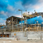 Water tanks and reverse osmosis equipment in a desalination plant.